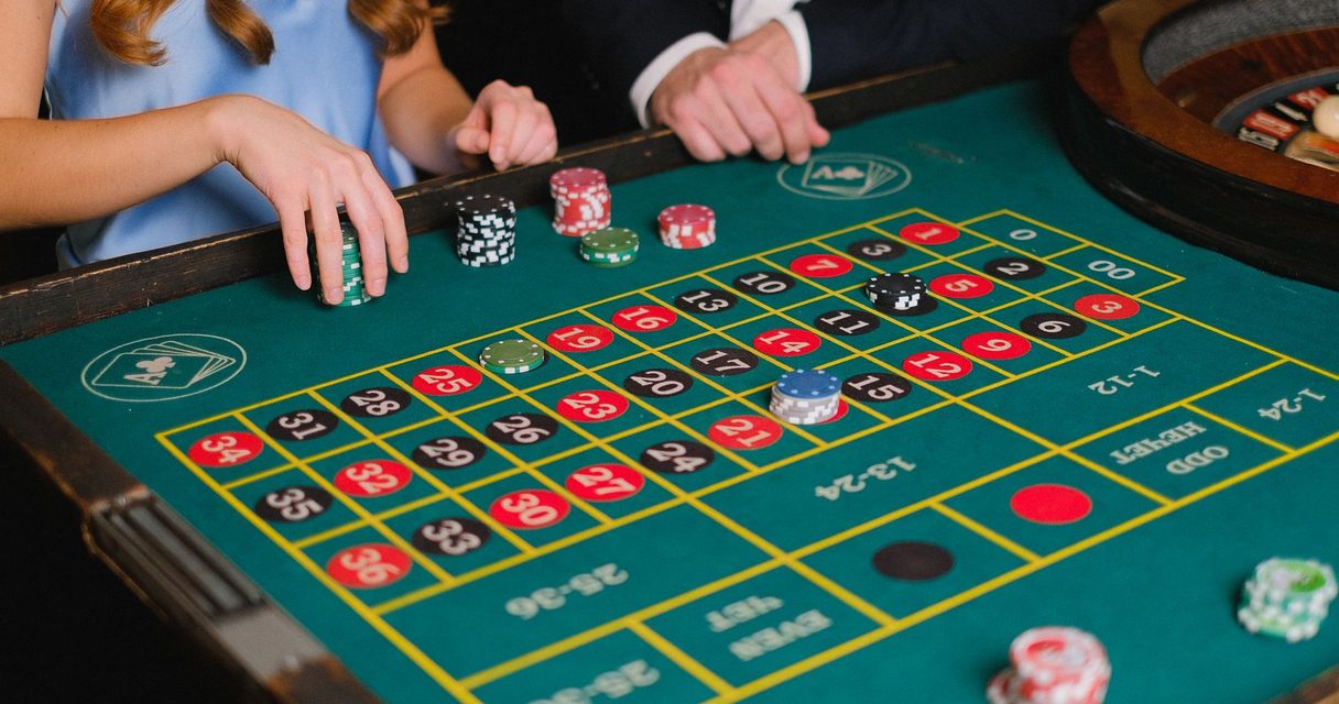 Casino chips and cards representing the Roobet welcome bonus
