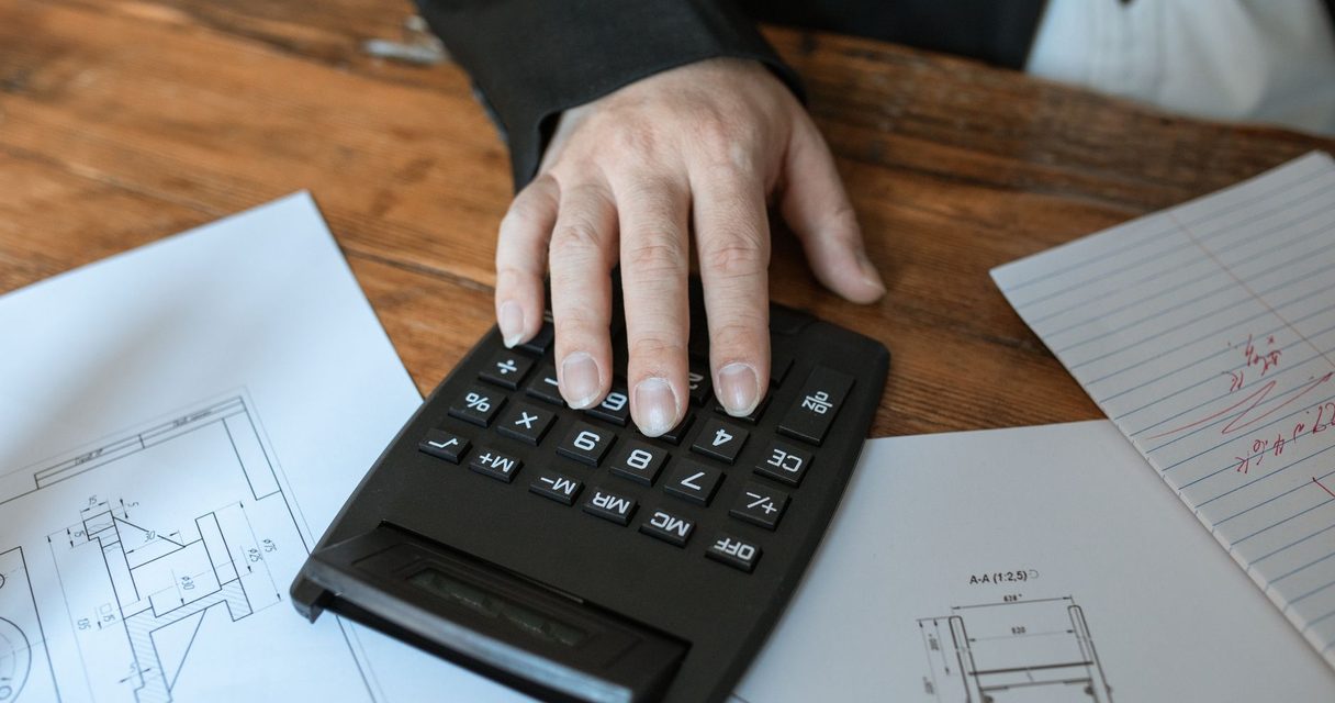 Calculator on a desk showing wagering math