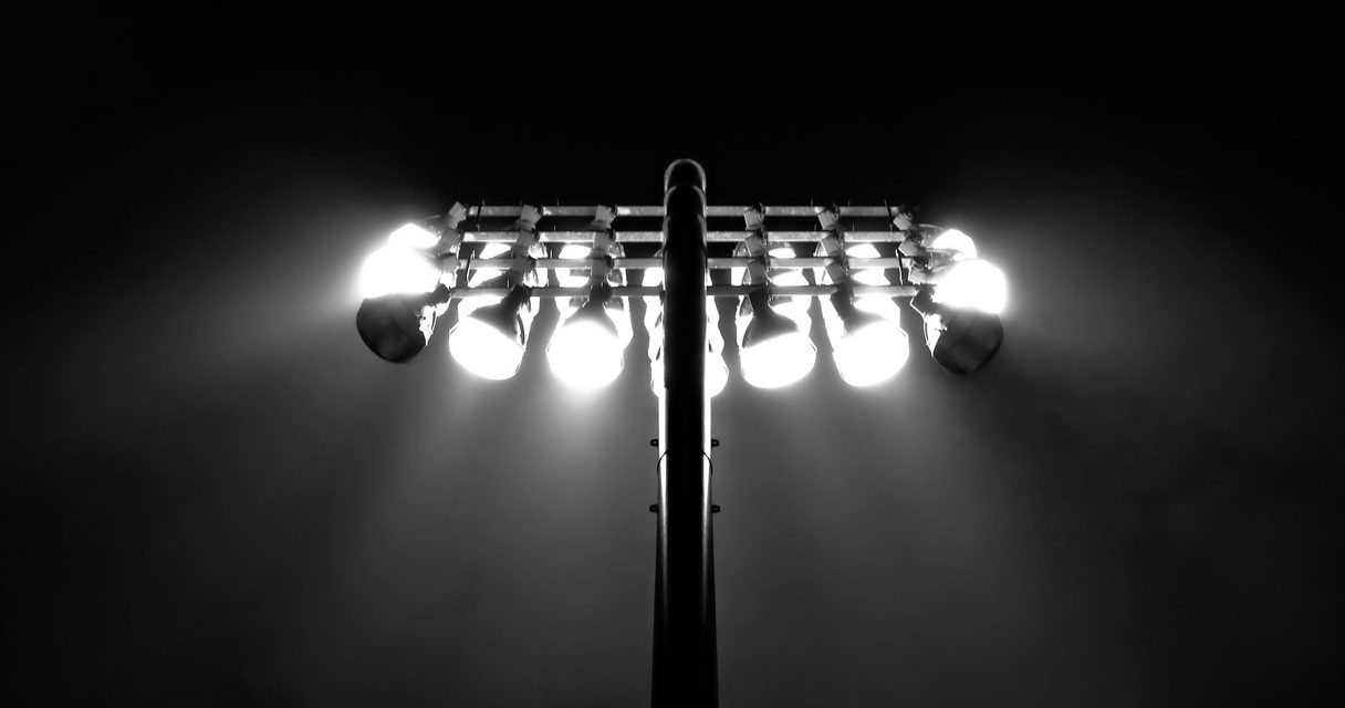 Stadium floodlights above a pitch โ Roobet Sportsbook